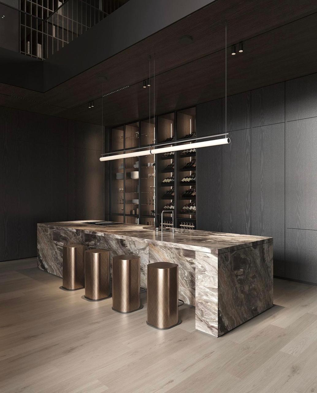 Large kitchen island with a built-in sink and seating area, featuring a granite countertop.